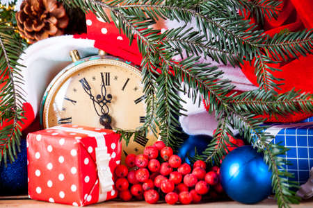 Christmas wreath and clock clothe up. Greeting card. Christmas backgroundの写真素材