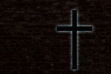 Glowing cross on a brick wall. Church backgroundの写真素材