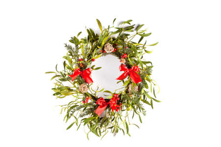 Christmas wreath with mistletoe isolated on white background. Christmas decorationの写真素材