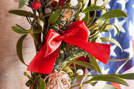 Christmas wreath with mistletoe and american flag. Christmas decorationの写真素材