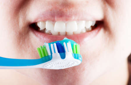 New tooth brush on the background of the person. Dental careの写真素材