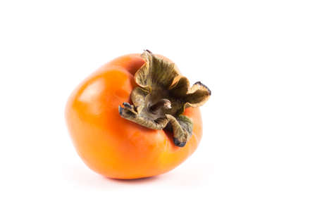 Ripe fresh persimmon isolated on white background. Food ingredient. Fruitsの写真素材