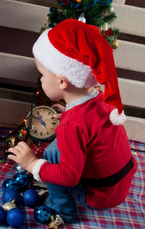 Children in Christmas clothes and santa hat. Christmas decoration.の写真素材