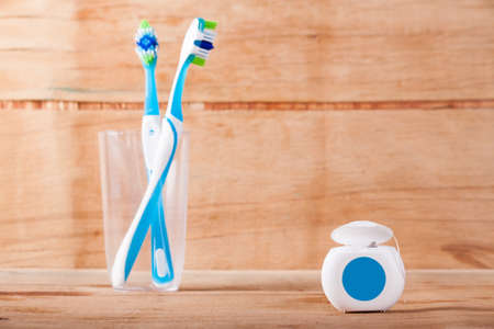 Dental floss isolated on wood desk. Dental careの写真素材