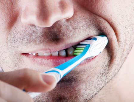 New tooth brush on the background of the person. Dental careの写真素材