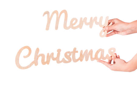Wood inscription Merry Christmas isolated on white backgroundの写真素材
