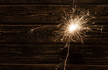 Fire spark xmas with wood background. Christmas backgroundの写真素材