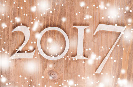 Wood inscription 2017 on wood board. Greeting cardの写真素材