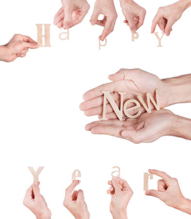 Hand holding Wood inscription Happy New Year on white background