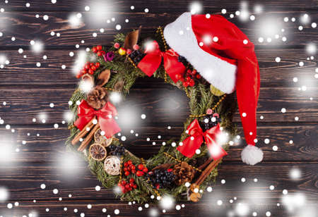 Christmas wreath on wood desk. Christmas decorationの写真素材