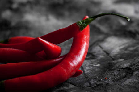 Fresh chili on grunge scratched background. Food backgroundの写真素材