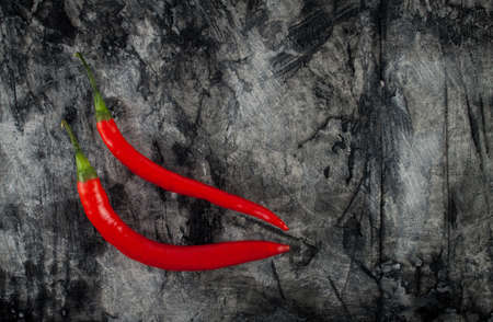 Fresh chili on grunge scratched background. Food backgroundの写真素材