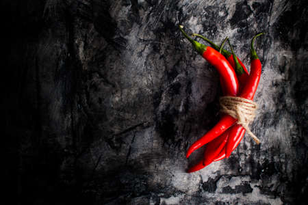 Fresh chili on grunge scratched background. Food backgroundの写真素材