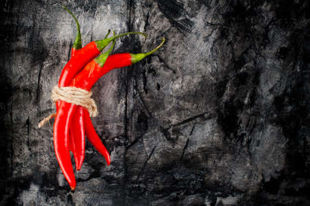 Fresh chili on grunge scratched background. Food backgroundの写真素材