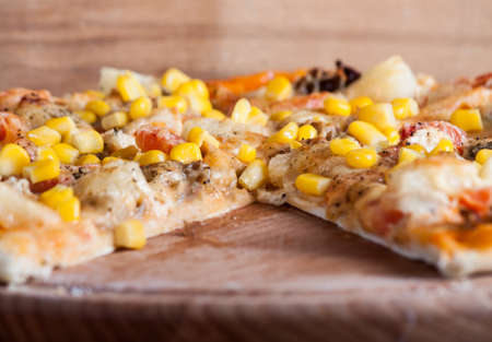 Fresh pizza with cheese on wood desk. Food backgroundの写真素材