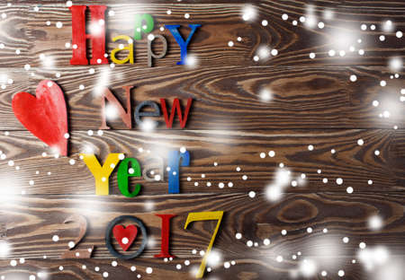 Multicolor wood inscription Happy New Year close up. Greeting cardの写真素材