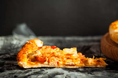 Fresh pizza with cheese on wood desk. Food background.の写真素材