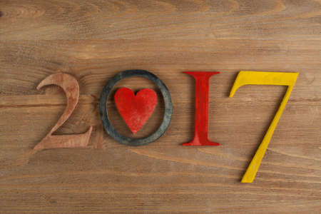 Wood inscription 2017 on wood board. Greeting cardの写真素材