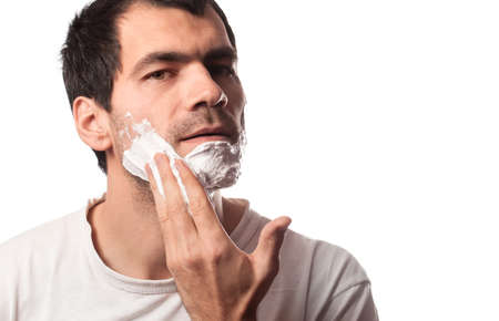 Time for new razor. Close-up young shirtless man holding razor