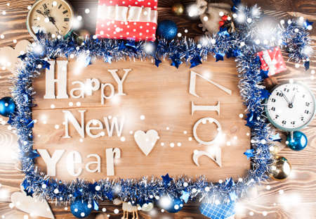 Wood inscription Happy New Year close up with snow. Greeting cardの写真素材