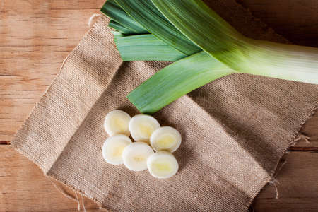 Ripe fresh leek on wood desk. Food ingredients