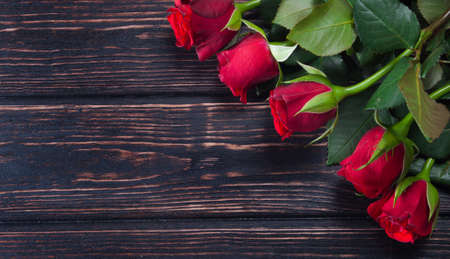 Fresh rose on wood desk. Nature backgroundの写真素材