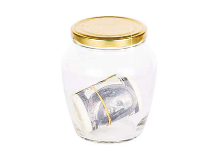 Dollar banknote in glass jar isolated on white backgroundの写真素材