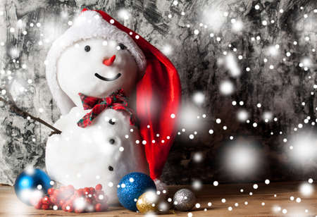 Snowman on wood desk. Greeting card. Christmas backgroundの写真素材