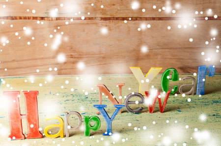Multicolor wood inscription Happy New Year close up. Greeting cardの写真素材