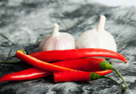 Garlic and chili on scratched background. Food ingredients. Nature background.の写真素材