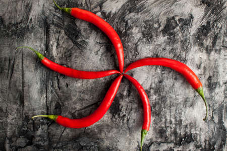 Red fresh chili on wood desk. Food background. Cookingの写真素材