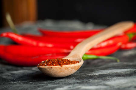 Red fresh chili on wood desk. Food background. Cookingの写真素材