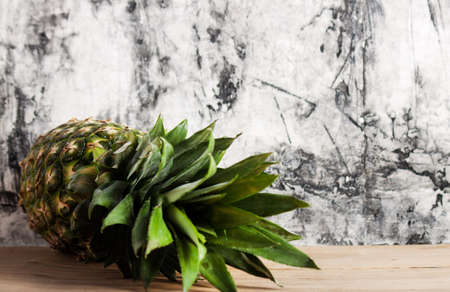 Ripe fresh pineapple on wood desk. Fruitsの写真素材