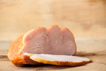 Smoked brisket close up on wood table. Meat productsの写真素材