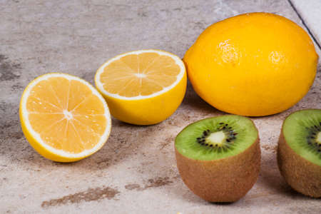 Ripe fresh kiwi isolated on wood desk. Food ingredient. Nature backgroundの写真素材