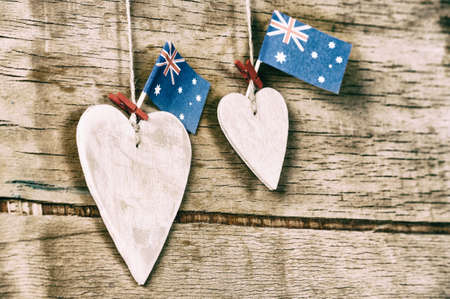 Wood heart and Australia flag on wood desk. National holidayの写真素材