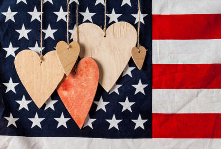 Wood hearts on american flag background. Greeting card. Valentine's day background.の写真素材