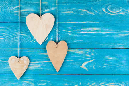 Wood hearts on old wood background. Greeting card. Valentine's day background.の写真素材