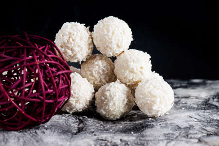 Candy with coconut and nuts on scratched background. Sweetsの写真素材