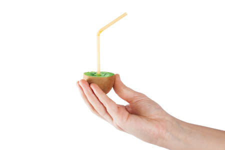 Ripe fresh kiwi close up in hand isolated in white backgroundの写真素材