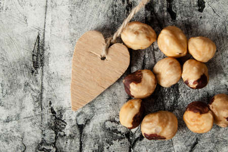 Roasted hazelnuts close up on wood desk. Foodの写真素材