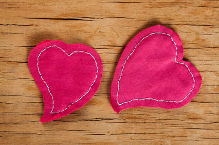 Heart made of cloth on wood desk. Valentine day. Holidays card with copy space