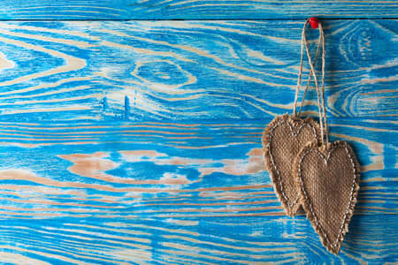 Heart made of cloth on wood desk. Valentine day. Holidays card with copy spaceの写真素材