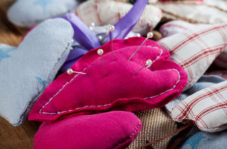 Heart made of cloth on wood desk. Valentine day. Holidays card with copy spaceの写真素材