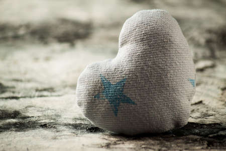 Heart made of cloth on wood desk. Valentine day. Holidays card with copy spaceの写真素材