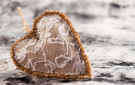 Heart made of cloth on wood desk. Valentine day. Holidays card with copy spaceの写真素材
