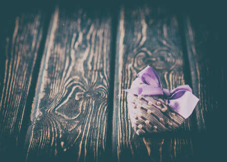 Heart made of cloth on wood desk. Valentine day. Holidays card with copy spaceの写真素材