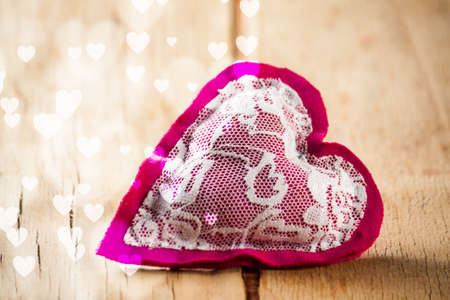 Heart made of cloth on wood desk. Valentine day. Holidays card with copy spaceの写真素材