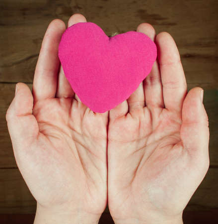 Heart from clothing in hand. Valentines day. International Women's Dayの写真素材