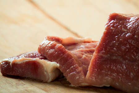 Piece of meat on wood desk. Food ingredients